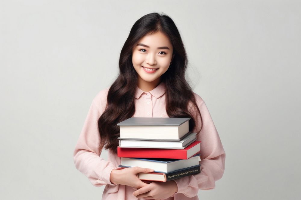 College student holding books publication reading smile. AI generated Image by rawpixel.
