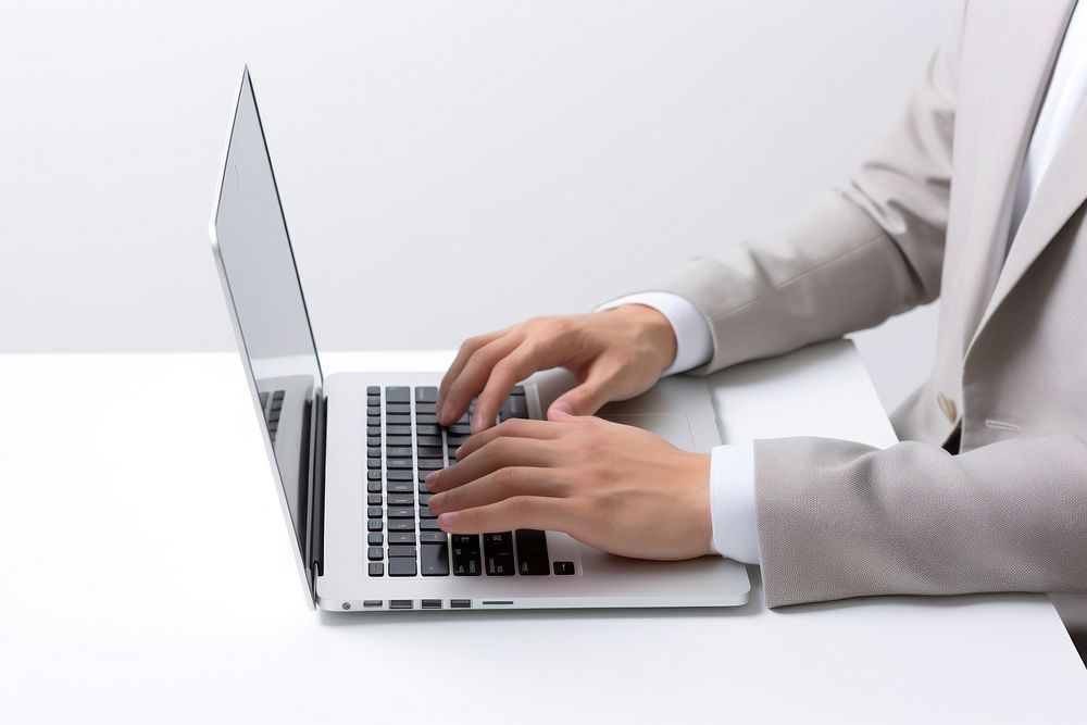 Man using laptop computer hand businesswear. AI generated Image by rawpixel.