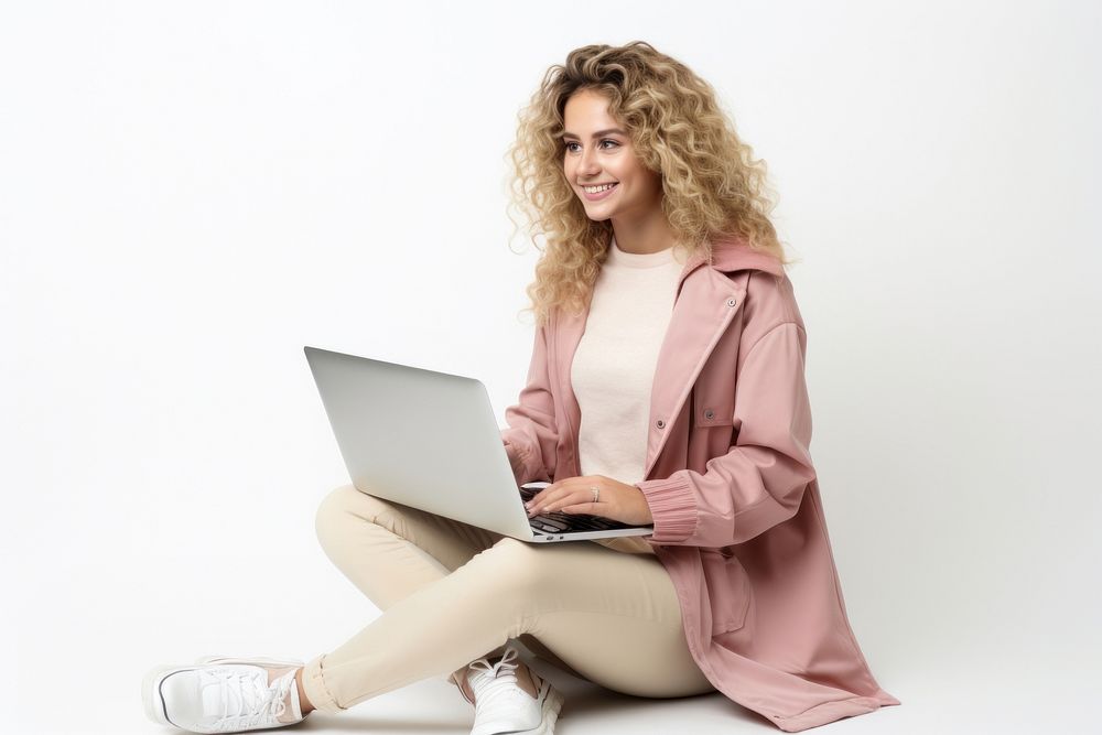 Woman using laptop computer sitting adult. AI generated Image by rawpixel.