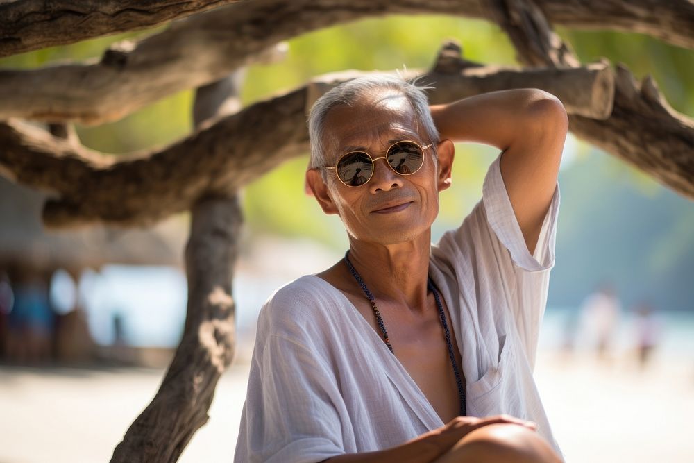 Japanese Asian relaxing at Railay Beach portrait glasses adult. AI generated Image by rawpixel.