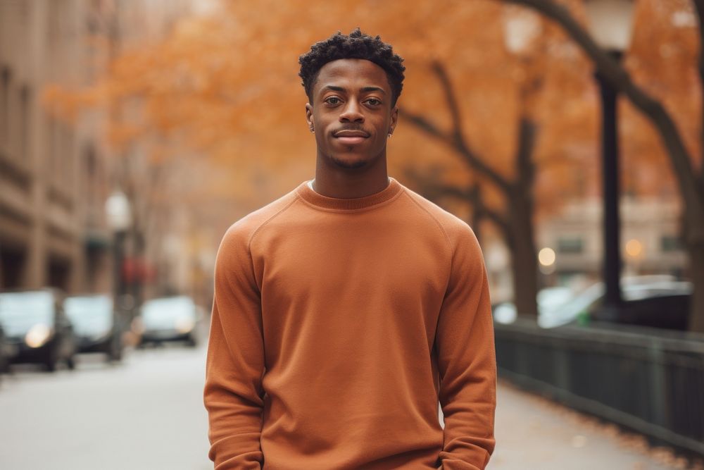 Young black man portrait standing sweater.