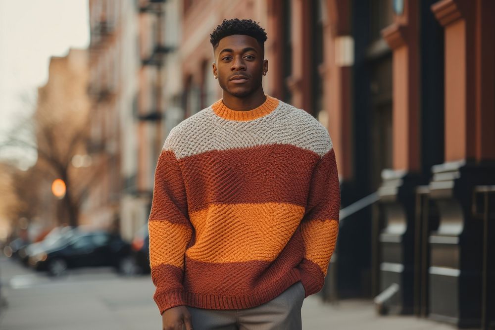 Young black man sweater standing architecture.