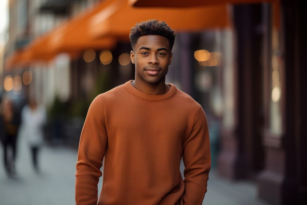 Young black man sweater standing portrait.