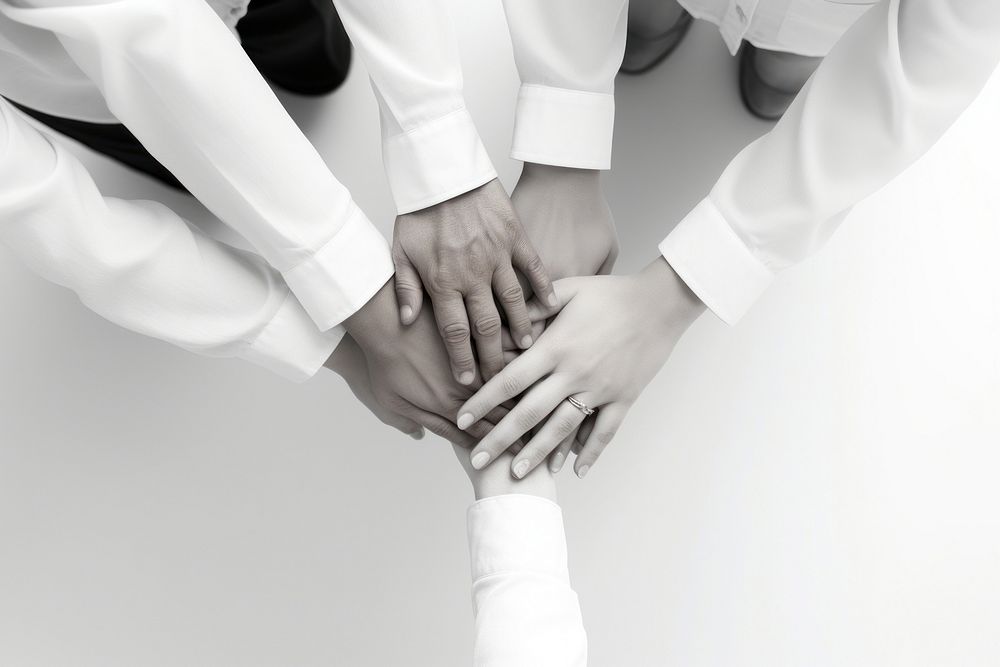 Business people putting their hands together finger adult white. AI generated Image by rawpixel.
