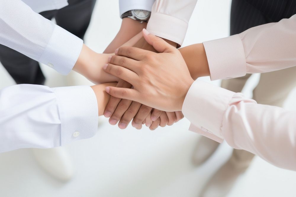 Business people putting their hands together togetherness cooperation agreement. AI generated Image by rawpixel.