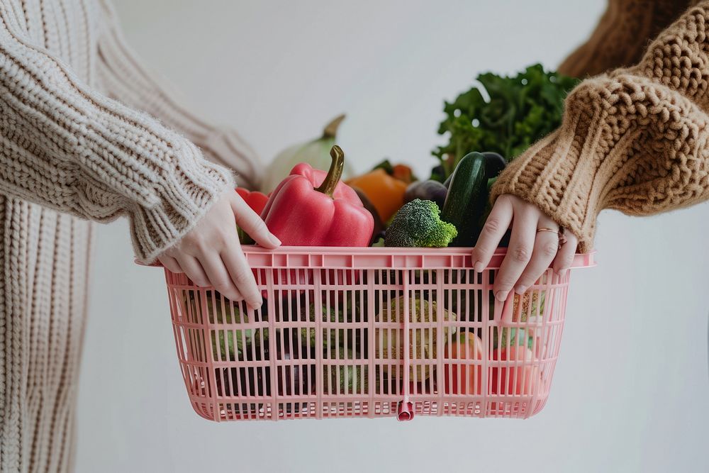 Vegetable plastic basket hand pink consumerism. AI generated Image by rawpixel.