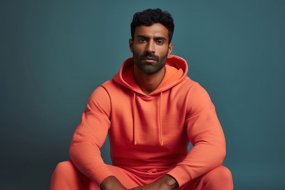 Indian man sweatshirt portrait sitting.