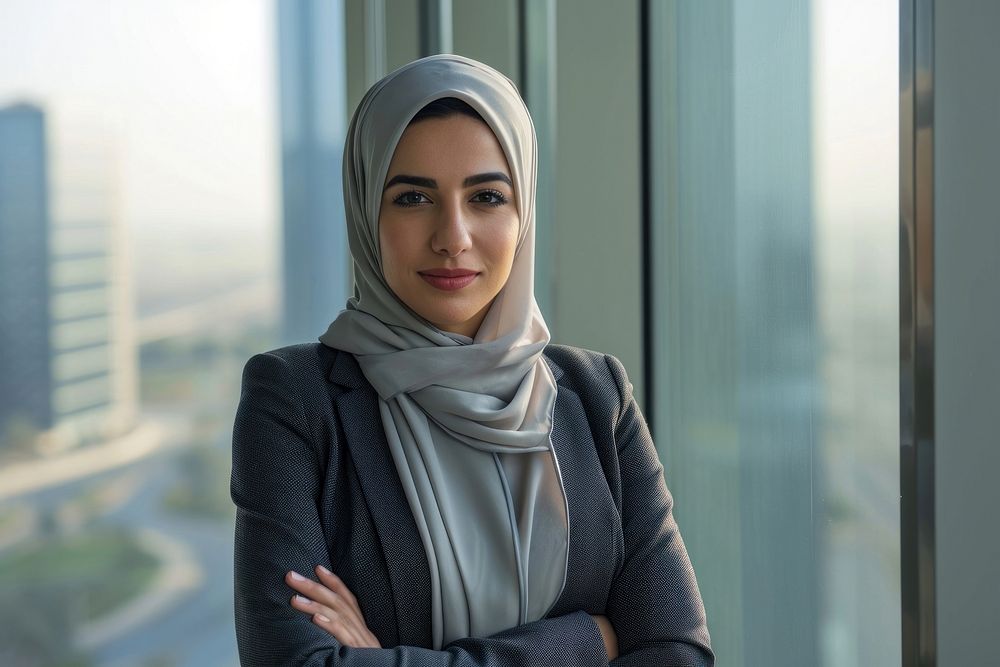 Business photo of middle east woman scarf city architecture.