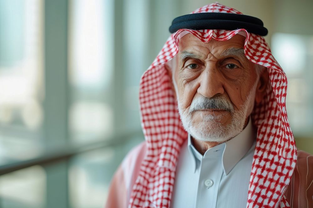 Business photo of saudi old man clothing traditional clothing headscarf.