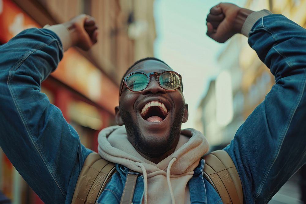 Black man and excited happiness shouting laughing.