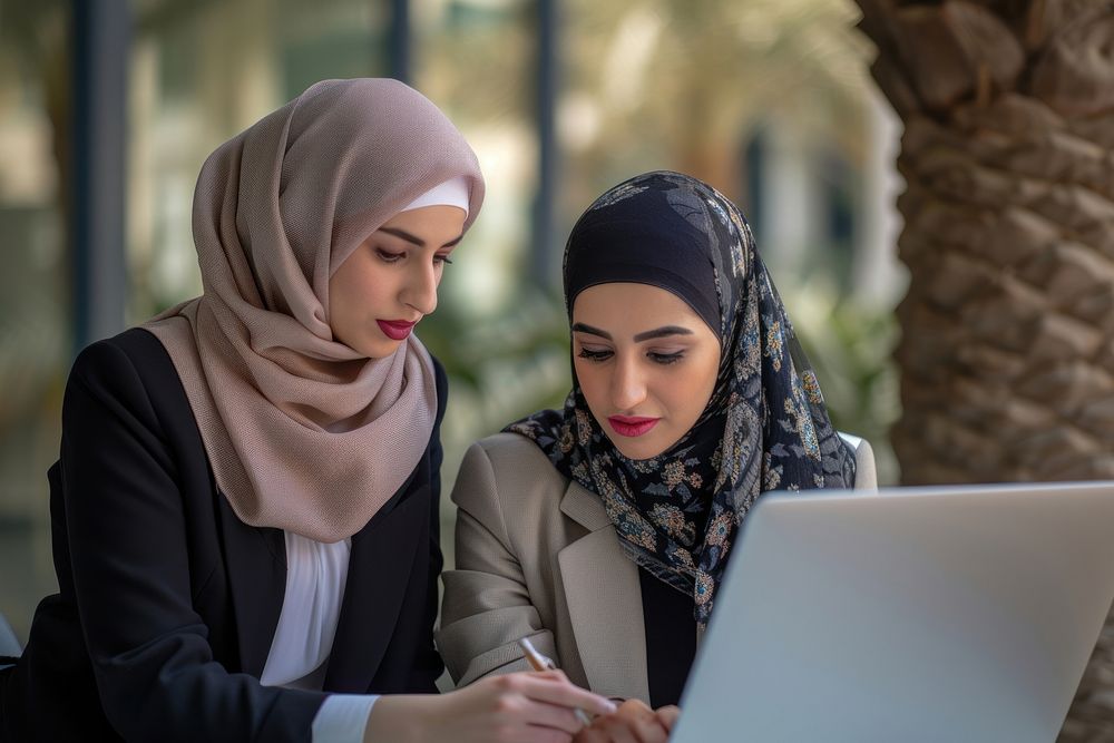 Two middle east business woman computer laptop adult.