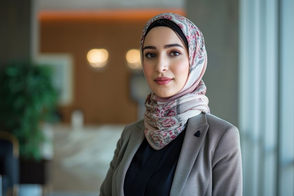 Candid photo of a arabbusiness woman standing scarf headscarf.