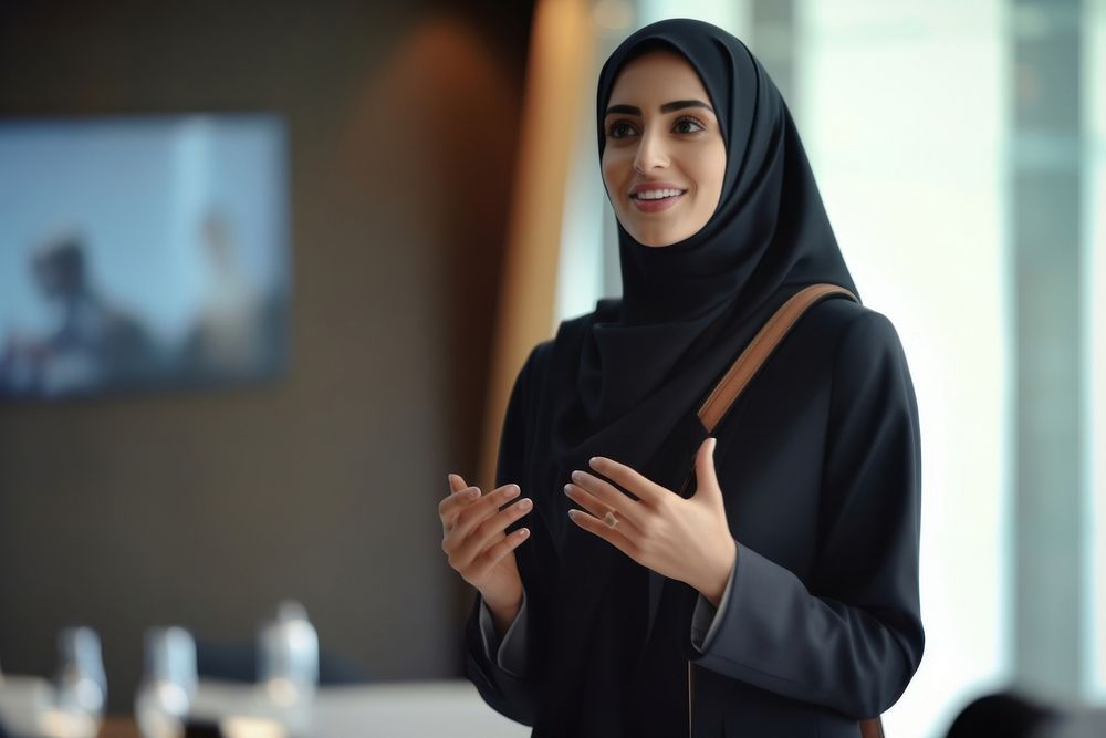 Candid photo of a arabbusiness woman standing technology happiness.