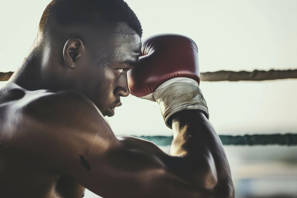 African American man boxing punching sports.