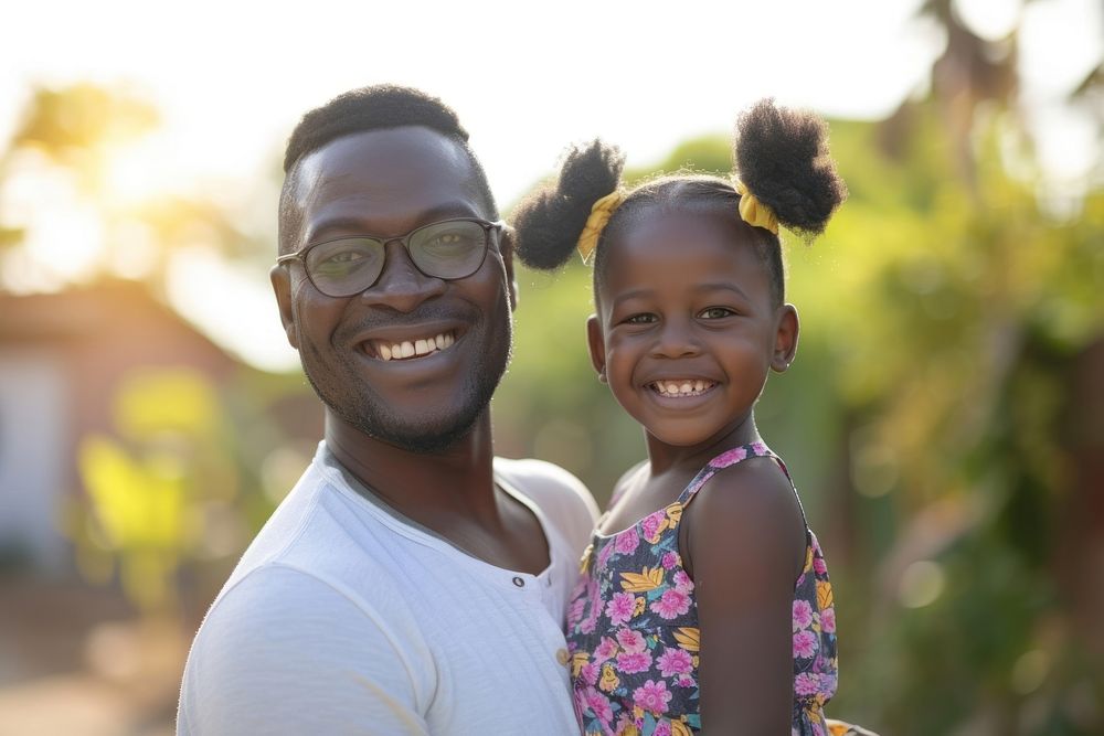 South afican dad carry daughter child smile happiness.