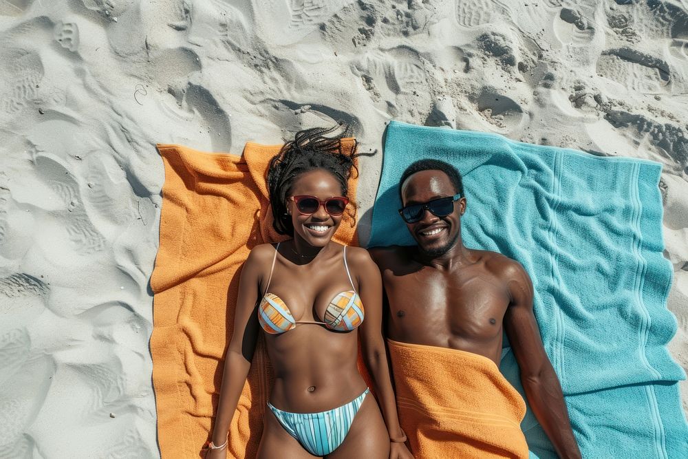 South african couple beach sunbathing sunglasses.
