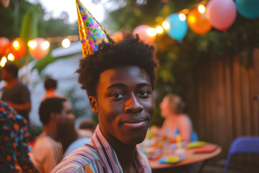 Black man at birthday party photography portrait outdoors.