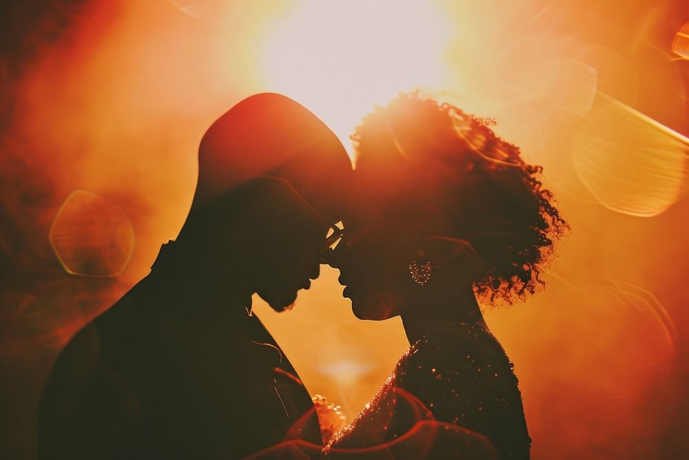Black people descent couple dancing wedding celebrate kissing red affectionate.