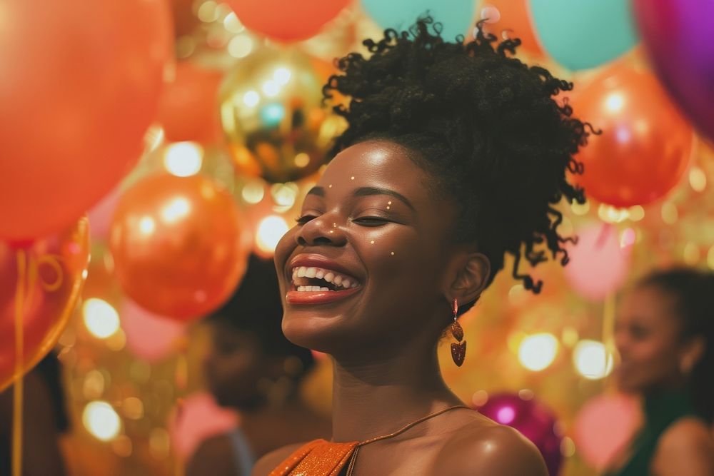 Black woman at birthday party laughing balloon adult.