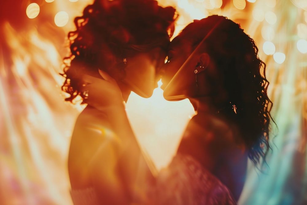 Black lesbian couple dancing on wedding celebrate kissing light adult.