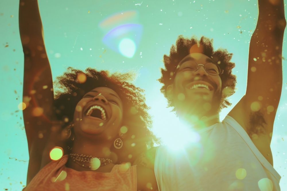 Happy black couple celebrating photography laughing portrait.