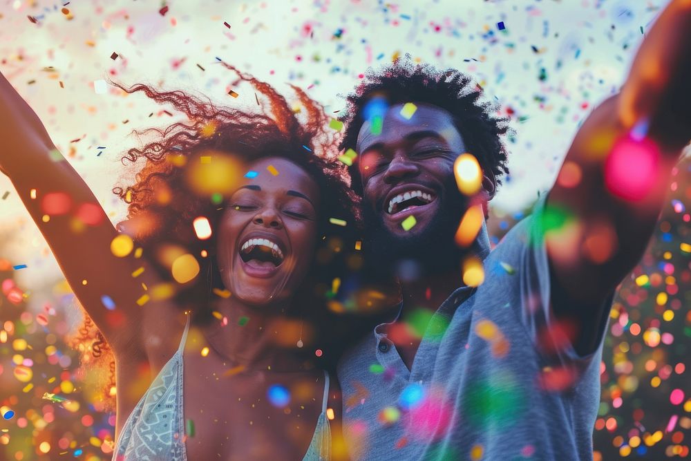 Happy black couple celebrating laughing adult vibrant color.