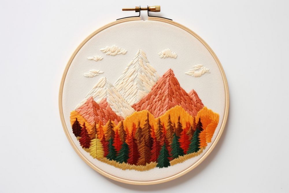 A piece of cute autumn Mountains in embroidery style mountain pattern representation.