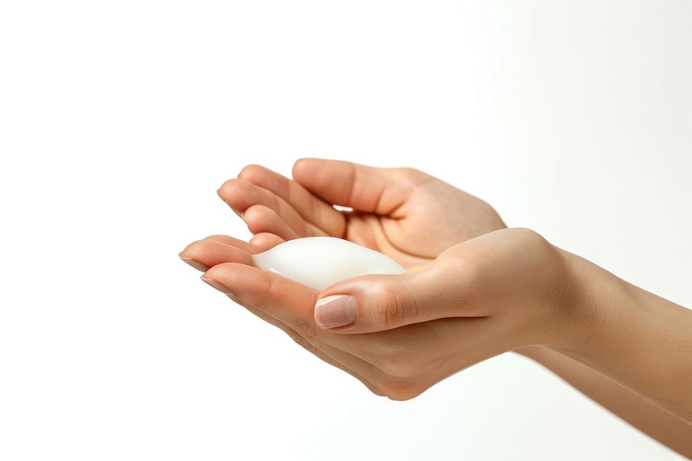 A woman hands with lotion finger white background fingernail.