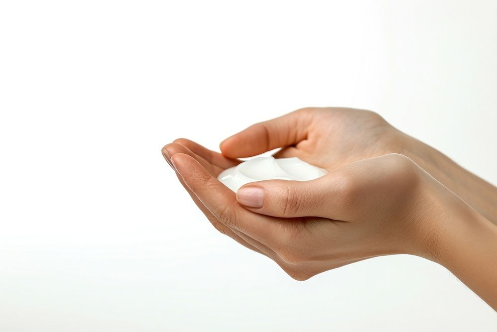 A woman hands with lotion finger white background medication.