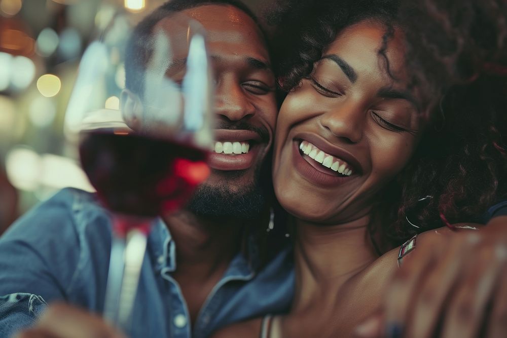 Happy black woman couple celebrating drink drinking laughing.