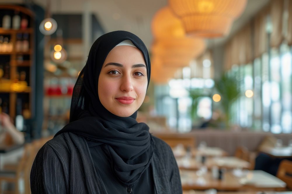 A middle eastwoman owner at restaurant portrait scarf architecture.