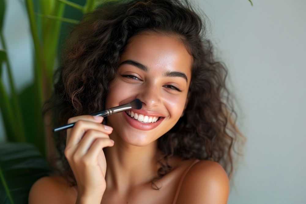 A latina brazilian woman cosmetics applying makeup.