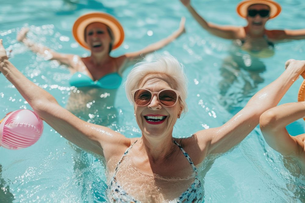 Woman wearing blank white swiming suit recreation swimming laughing.