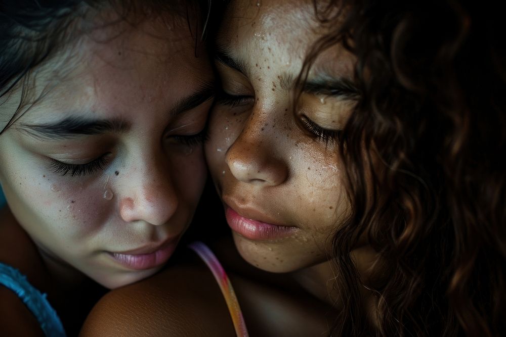 Latina Brazilian teen friend are consoling a friend who is crying heavily portrait skin togetherness.