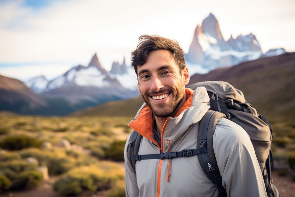 Smiling Latino man with backpack outdoors backpacking photography.