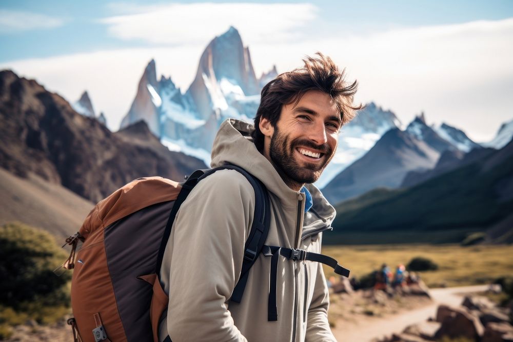 Smiling Latino man with backpack outdoors backpacking adventure.