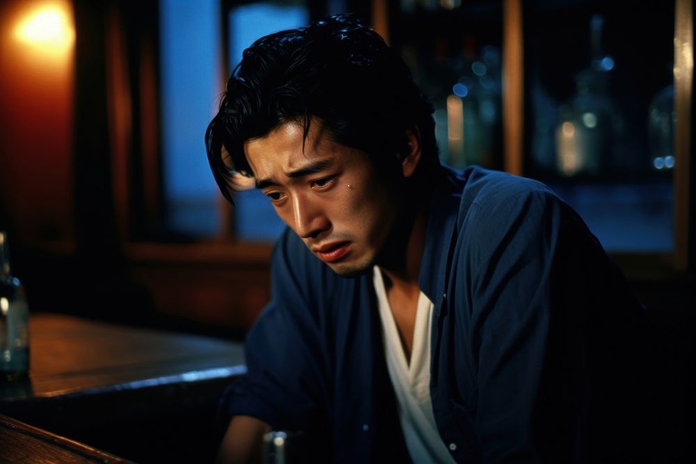 Young male crying in the bar worried men sad. AI generated Image by rawpixel.