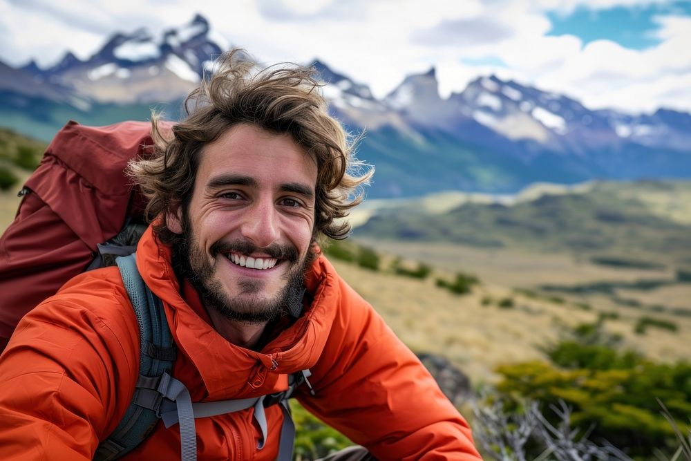 Happy argentine man outdoors backpacking adventure.