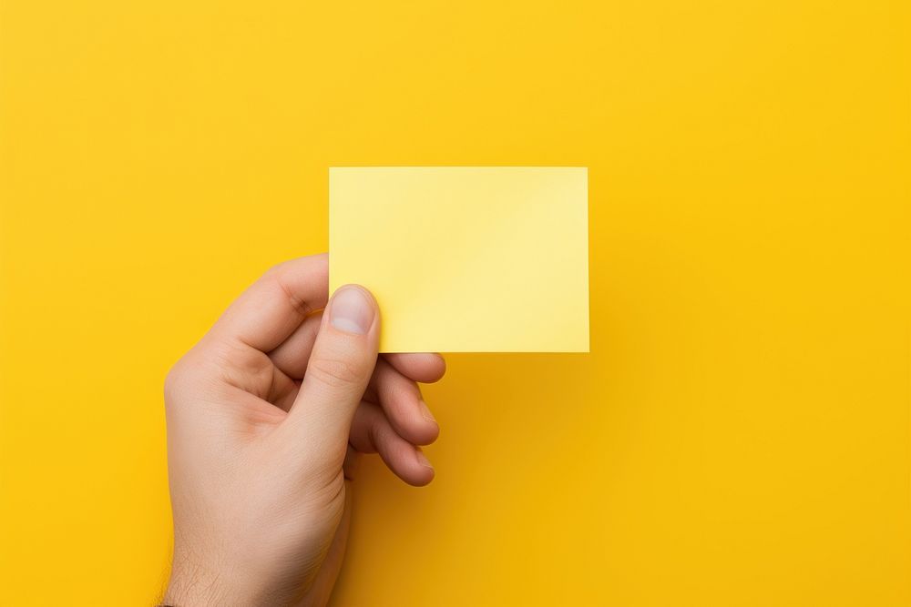 Sticky note holding yellow paper. AI generated Image by rawpixel.