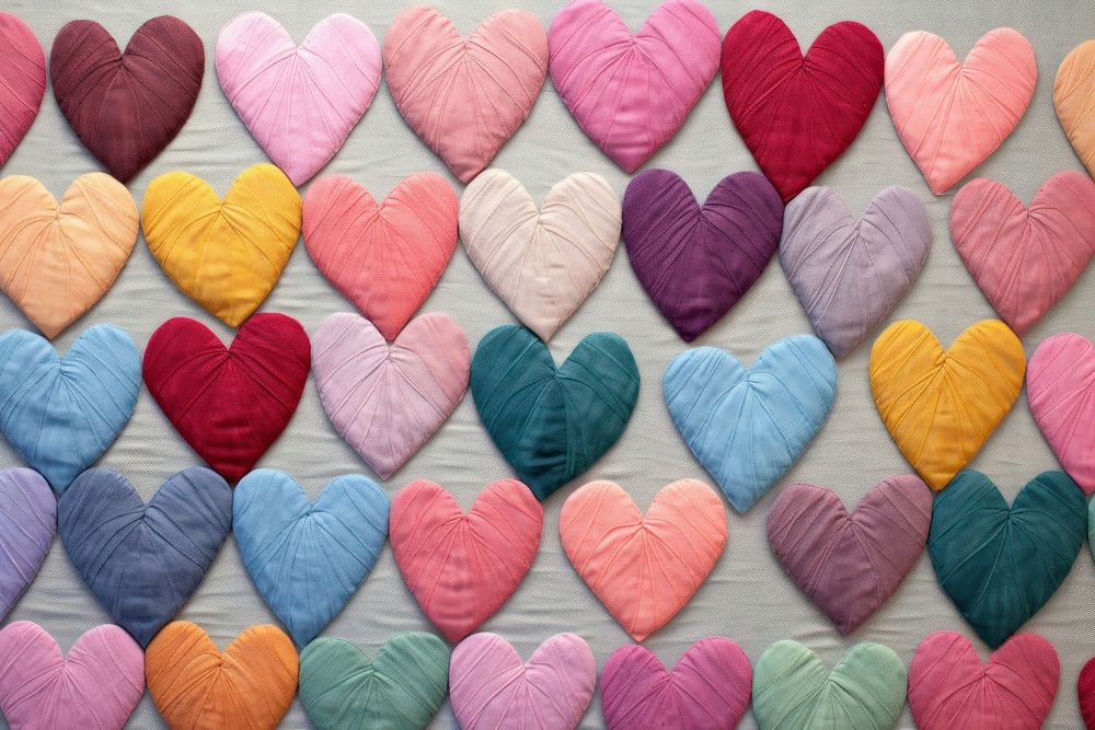 Pastel hearts pattern textile thread craft.