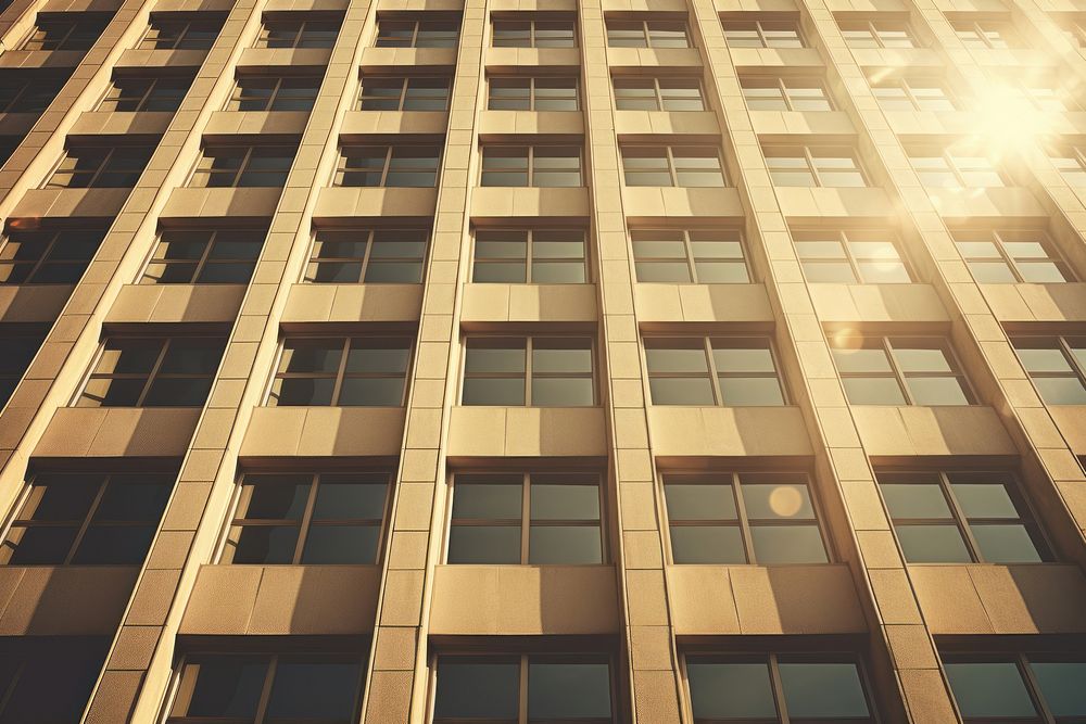 Retro office building top architecture sunlight city. AI generated Image by rawpixel.