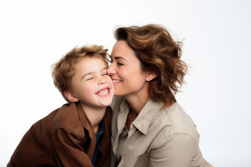 Mom kissing and hugging funny son face photography laughing portrait.