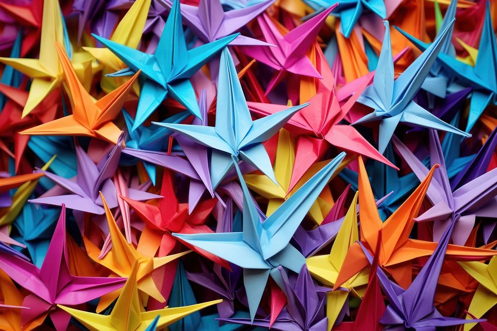 Colorful origami paper cranes backgrounds art creativity.