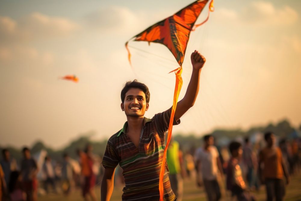 Bangladeshi young mans kite festival flying.