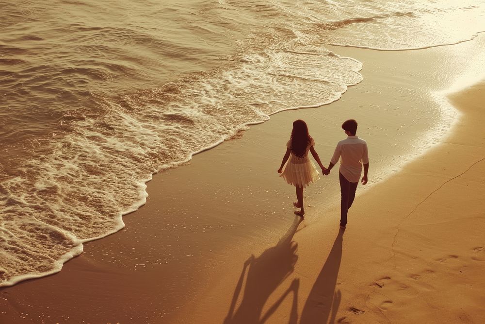 Indian young couple walking beach outdoors.