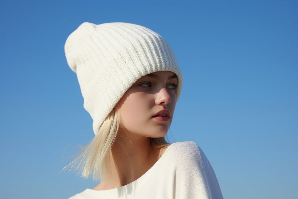 White beanie hat adult blue sky.