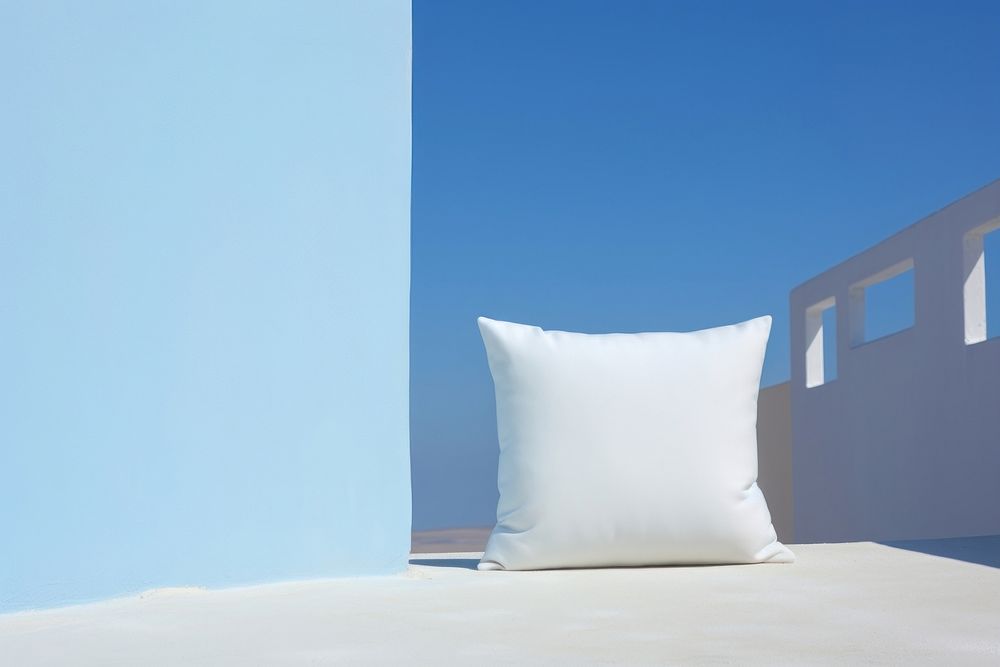 White cushion pillow blue sky architecture.