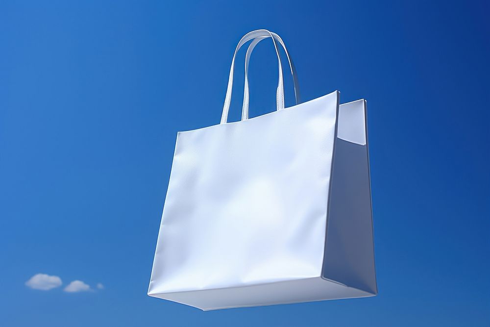 White shopping bag handbag blue sky.