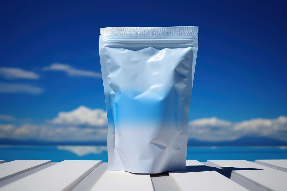 White snack Bag Packaging open outdoors blue sky.