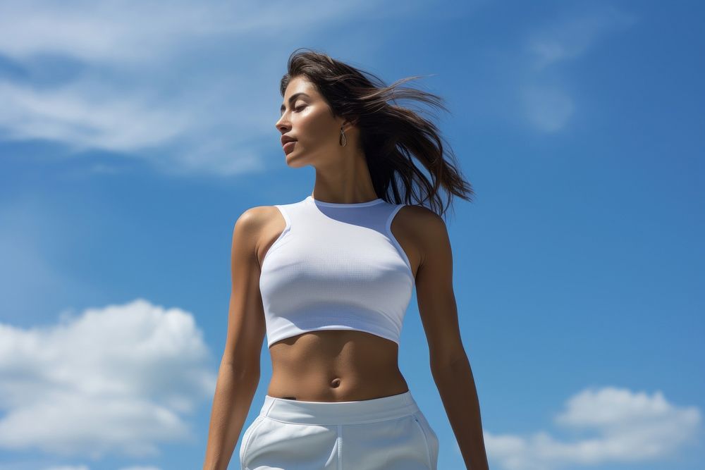 Close up white top fitness outfit adult blue sky.